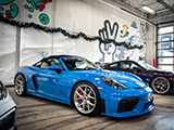 Blue Porsche 718 Spyder at Alpha Garage Chicago