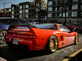 Rear Quarter of Red Acura NSX on Gold Wheels
