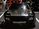 Front of Black RX-7 with Carbon Fiber Hood