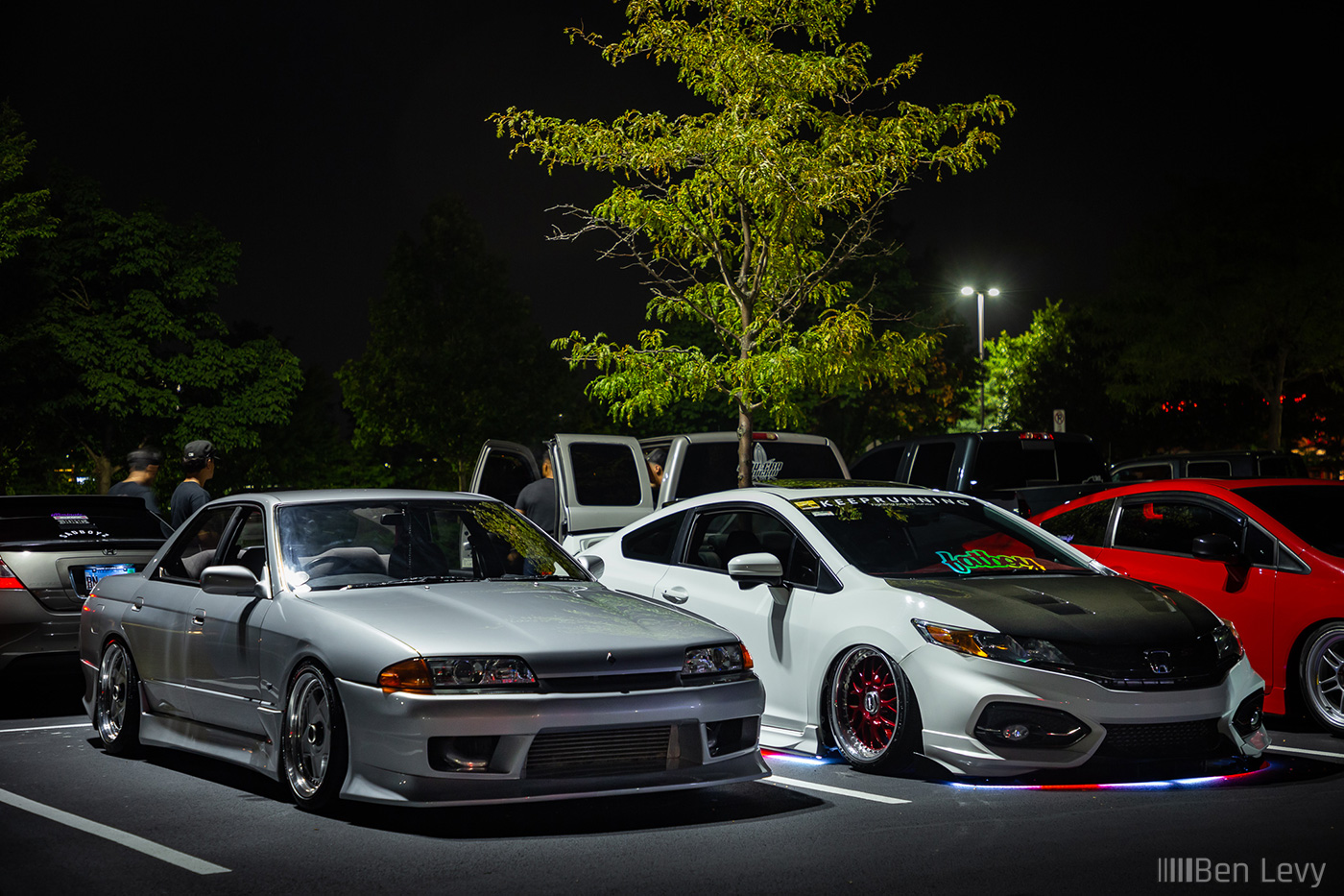 Silver Skyline and White Civic at Car Meet at Night