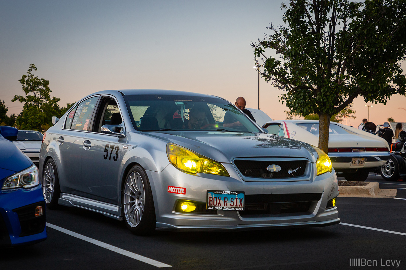 Silver Subaru Legacy with Yellow Headlights