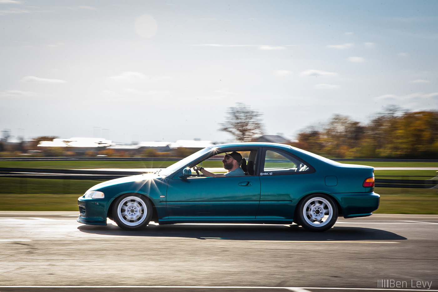Rolling Shot of Teal Honda Civic Coupe