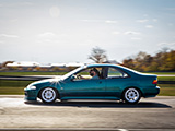 Rolling Shot of Teal Honda Civic Coupe
