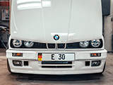 Front of White E30 BMW with the Hood Open