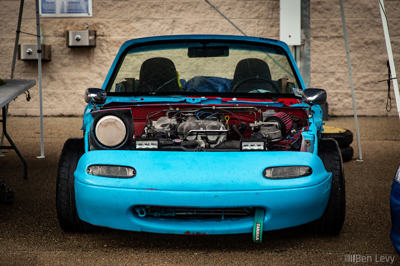Beat Up Miata that's been spraypainted blue