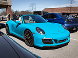 Blue 911 Carrera GTS with the top off