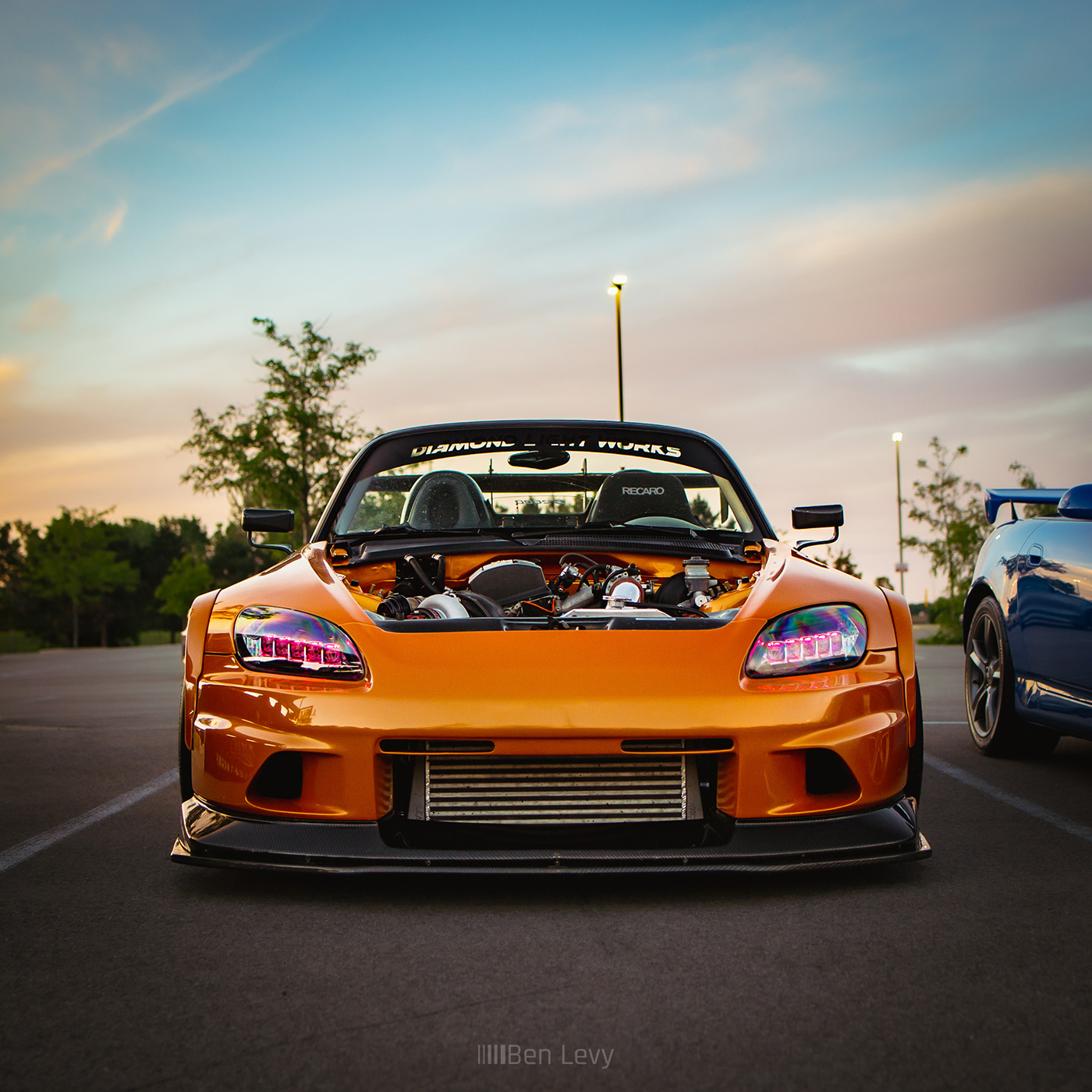 Front of Orange Honda S2000 with Voltex Front