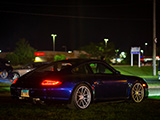 Blue Porsche 911 in the field at Rockford Speedway