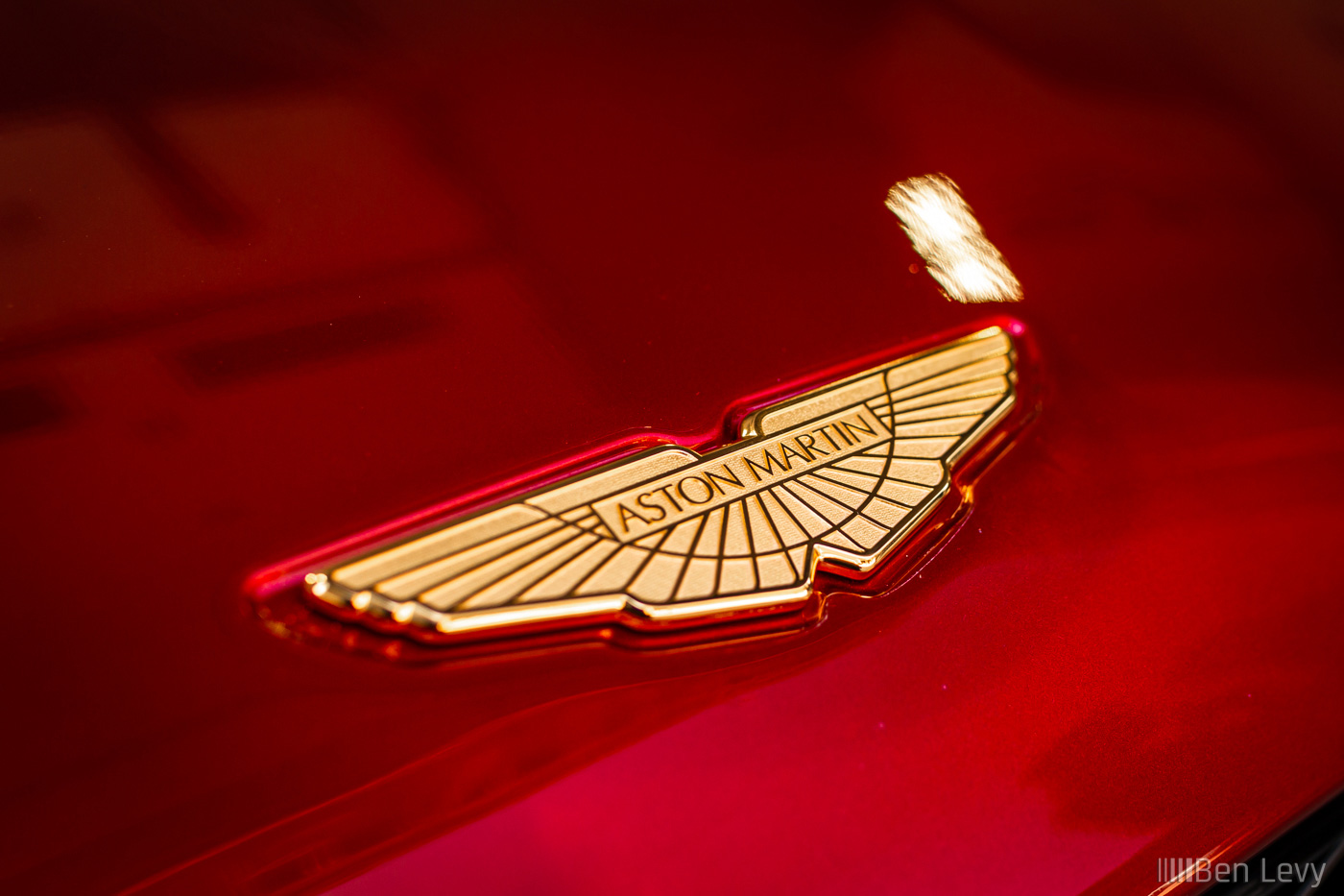 Gold Emblem on the front of an Aston Martin Vanquish Zagato