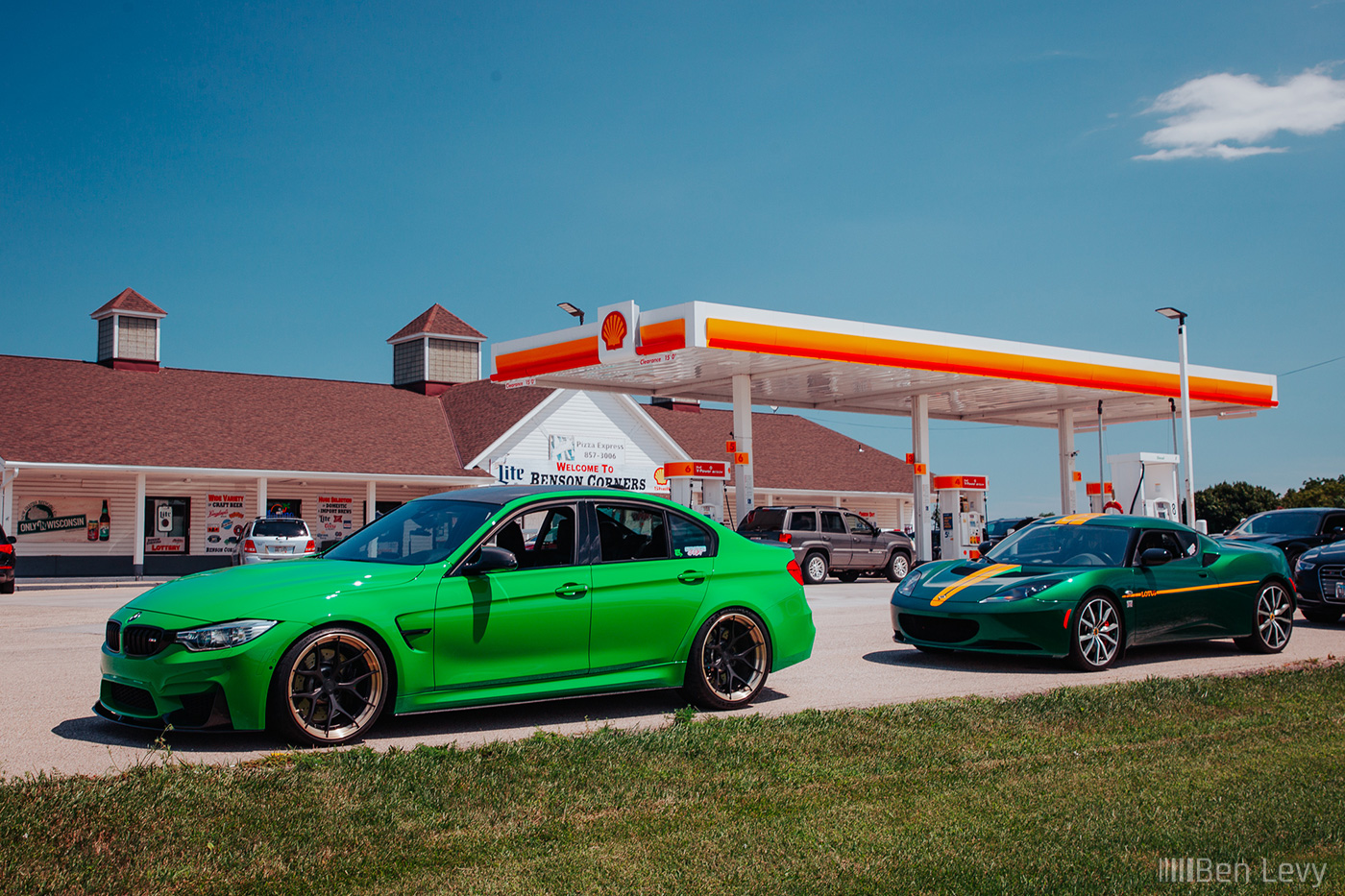 Green M3 and Lotus Evora at a Shell Gas Station