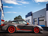 Side of a Grey Porsche 997 GT3 RS with Red Wheels