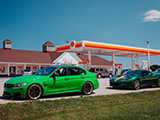 Green M3 and Lotus Evora at a Shell Gas Station
