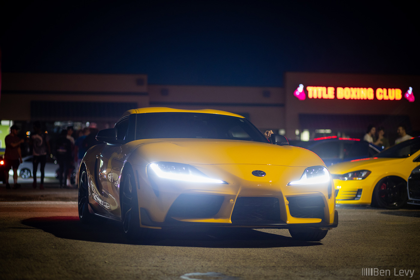 Yellow Toyota Supra at Night