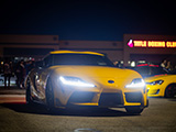 Yellow Toyota Supra at Night