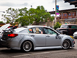 Silver H6 Subaru Legacy with Number 573
