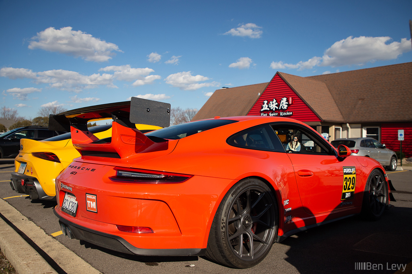 Orange Porsche 911 GT3 with Carbon Fiber Wing