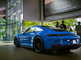 Blue Porsche 911 GT3 Touring in Dealership