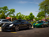 Black Cayman and Green Evora at Cars and Coffee