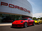 Red and Yellow Porsche GT3s in Front of Porsche Lincolnwood