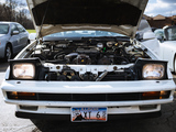 Pop Up Headlights on a White Subaru XT 6