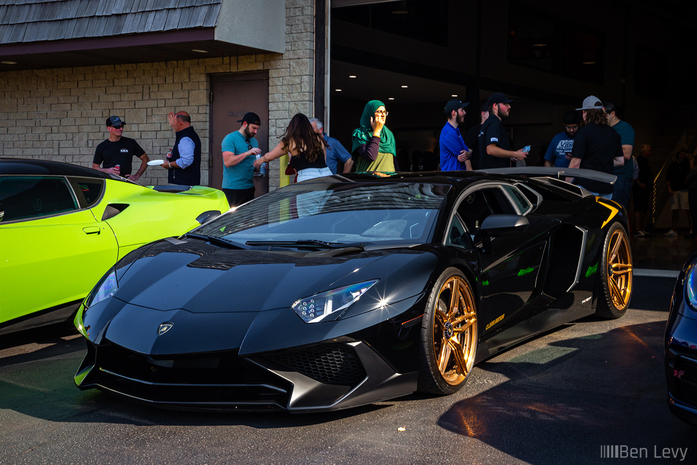 Black Lamborghini Aventador on Gold Wheels