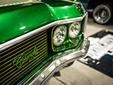 Chevrolet Badge on the Grill of a Green Caprice