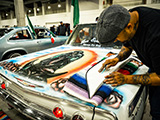Jerry Chingas doing custom pinstriping at the Slow & Low Car Show