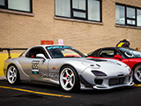 Silver Mazda RX-7 with the GRIDLIFE Crew