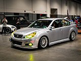 Silver Subaru Legacy with Yellow Headlights