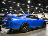 Blue Mk4 Supra at a Convention Center for Tuner Evo