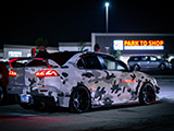 Camoflauge Wrapped Lancer Evo X in Parking Lot at Night