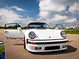 White Porsche 911 on the runway at an airport in Wisconsin