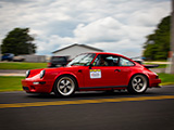 Red Porsche 911 on a back road in Wisconsin