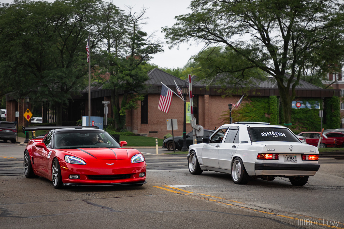 Corvette and 190E Meeting in the Street