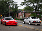 Corvette and 190E Meeting in the Street