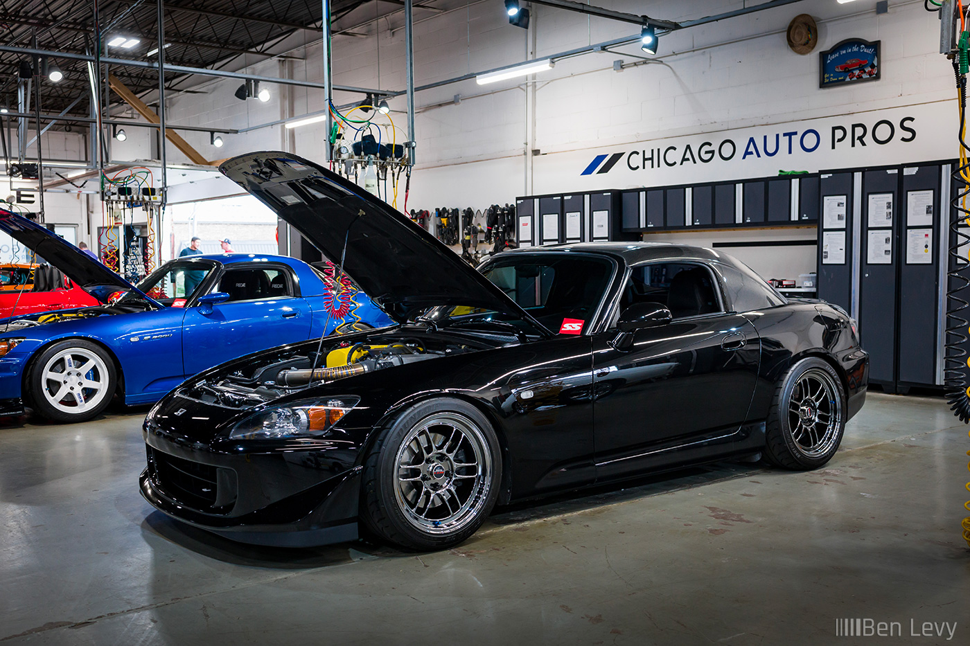 Black Honda S2000 at a bay in Chicago Auto Pros Lombard