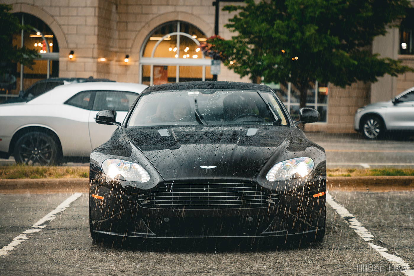 Front of Deep Brown Aston Martin Vantage V8 in the Rain