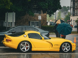 Side of Yellow Dodge Viper GTS in the Rain