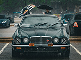 Old Jaguar XJ in the Pouring Rain