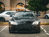 Front of Deep Brown Aston Martin Vantage V8 in the Rain