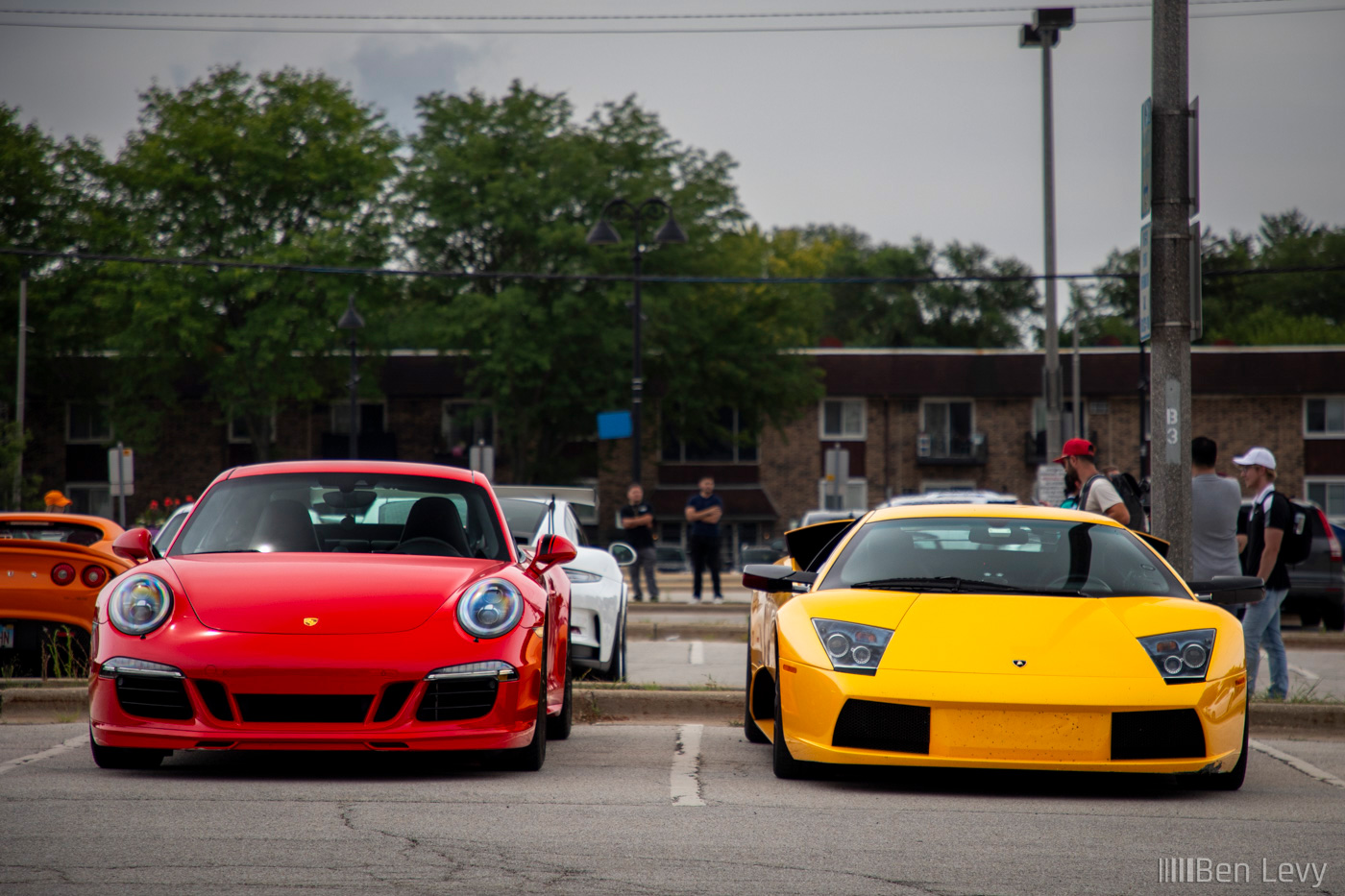Front of Porsche 911 GTS next to Lamborghini Murcielago