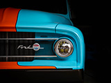 Blue Ford F100 Pickup Emerging from the Dark