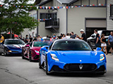 Blue Maserati MC20 Leading a Line of Cars