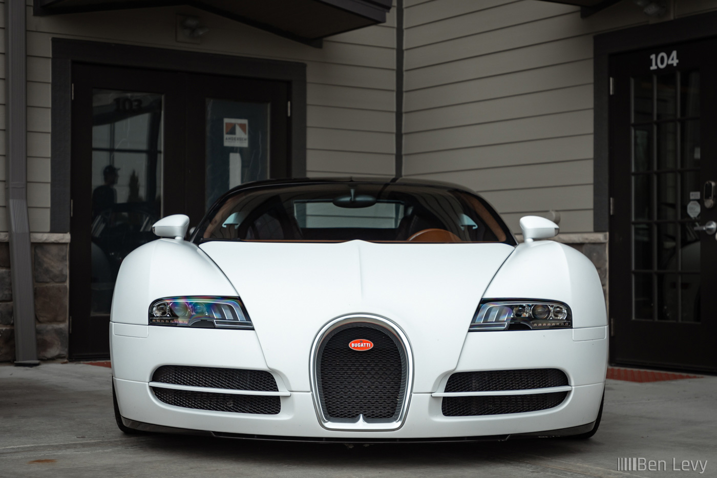 Front of White Bugatti Veyron with The Hamilton Collectiojn
