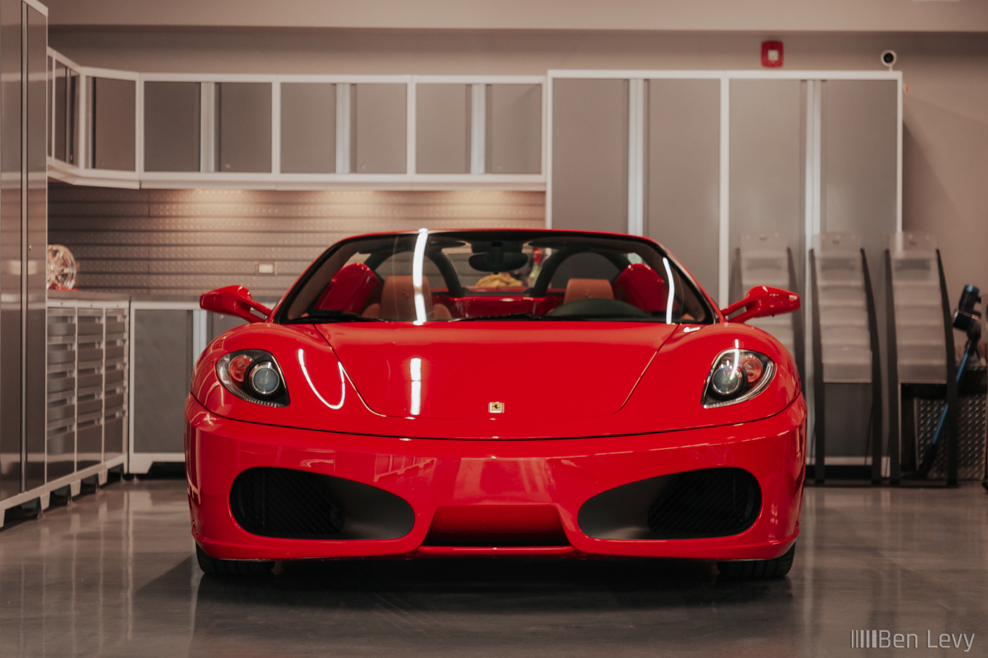 Red Ferrari F430 Spider in a Clean Garage