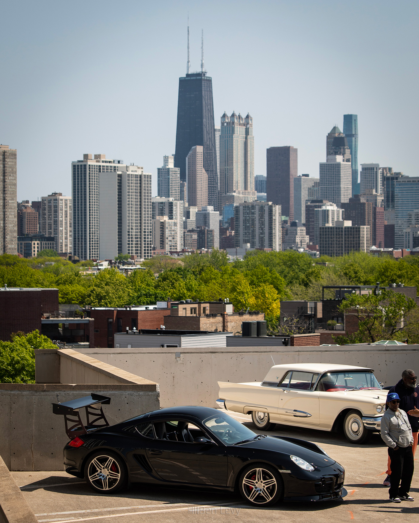 Black Porsche Cayman against the Chicago Skyline