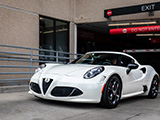 White Alfa Romeo 4C leaving a Chicago Parking Garage