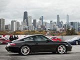 Black Porsche 996 against the Chicago Skyline