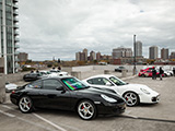 Black Porsche 911 and White Boxtser in a Chicago Garage