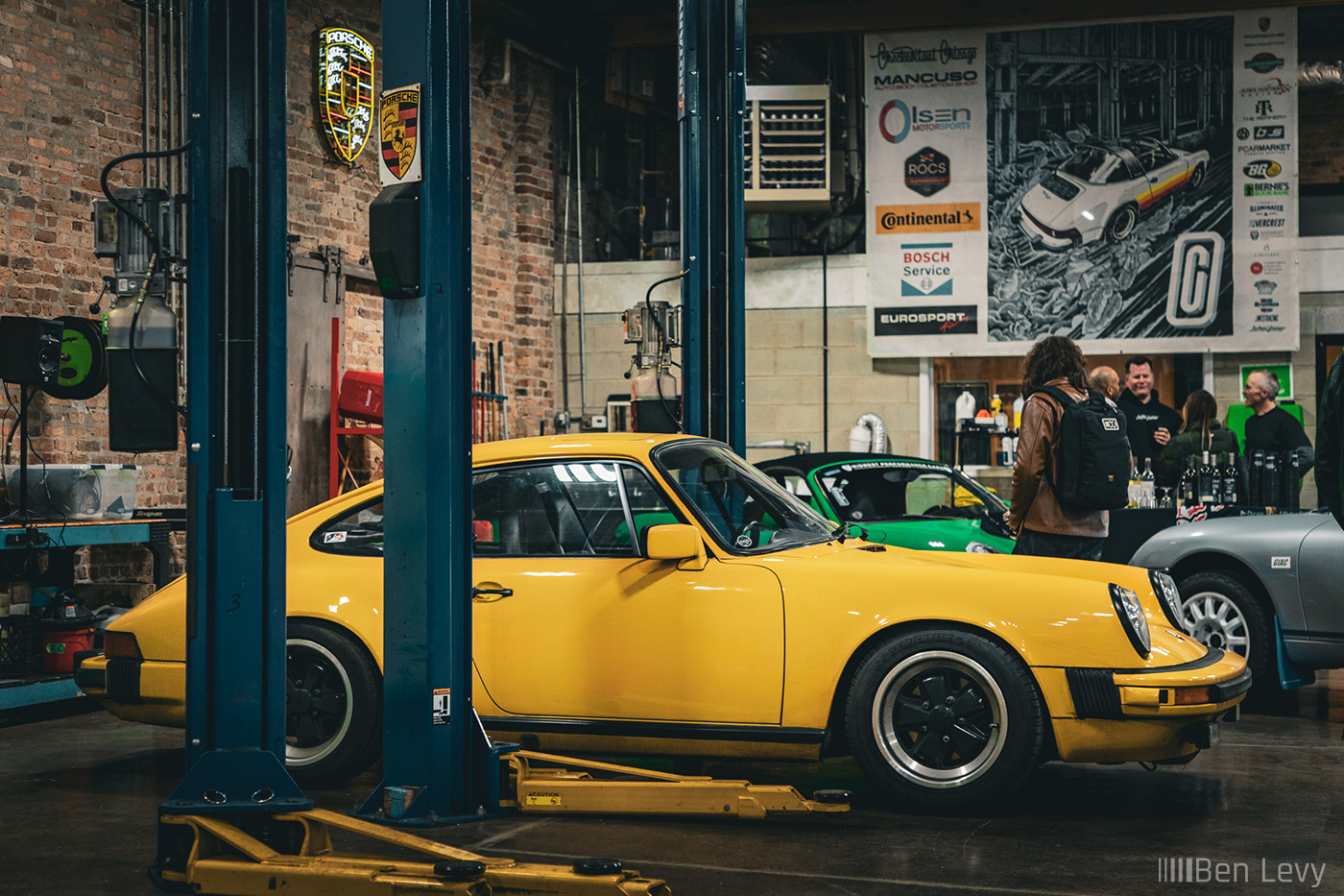 Yellow Porsche 911 SC at an Auto Repair Shop
